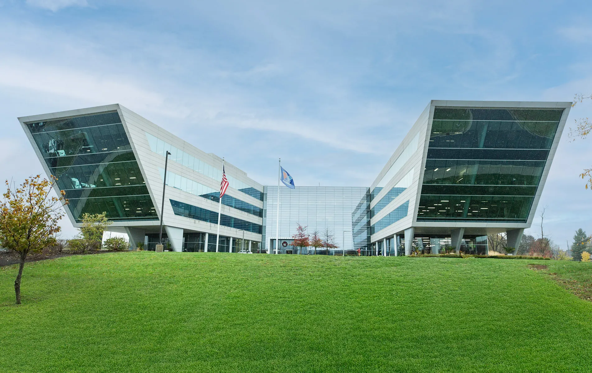 The modern and unique architecture of the Valvoline corporate headquarters on a cloudy day.