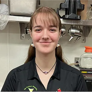Applebee's team member smiling in uniform