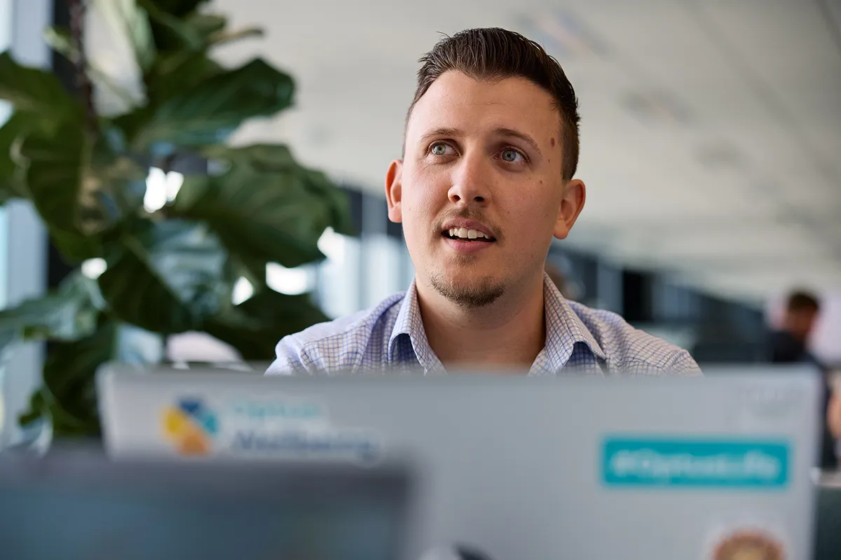 3 employees talking together