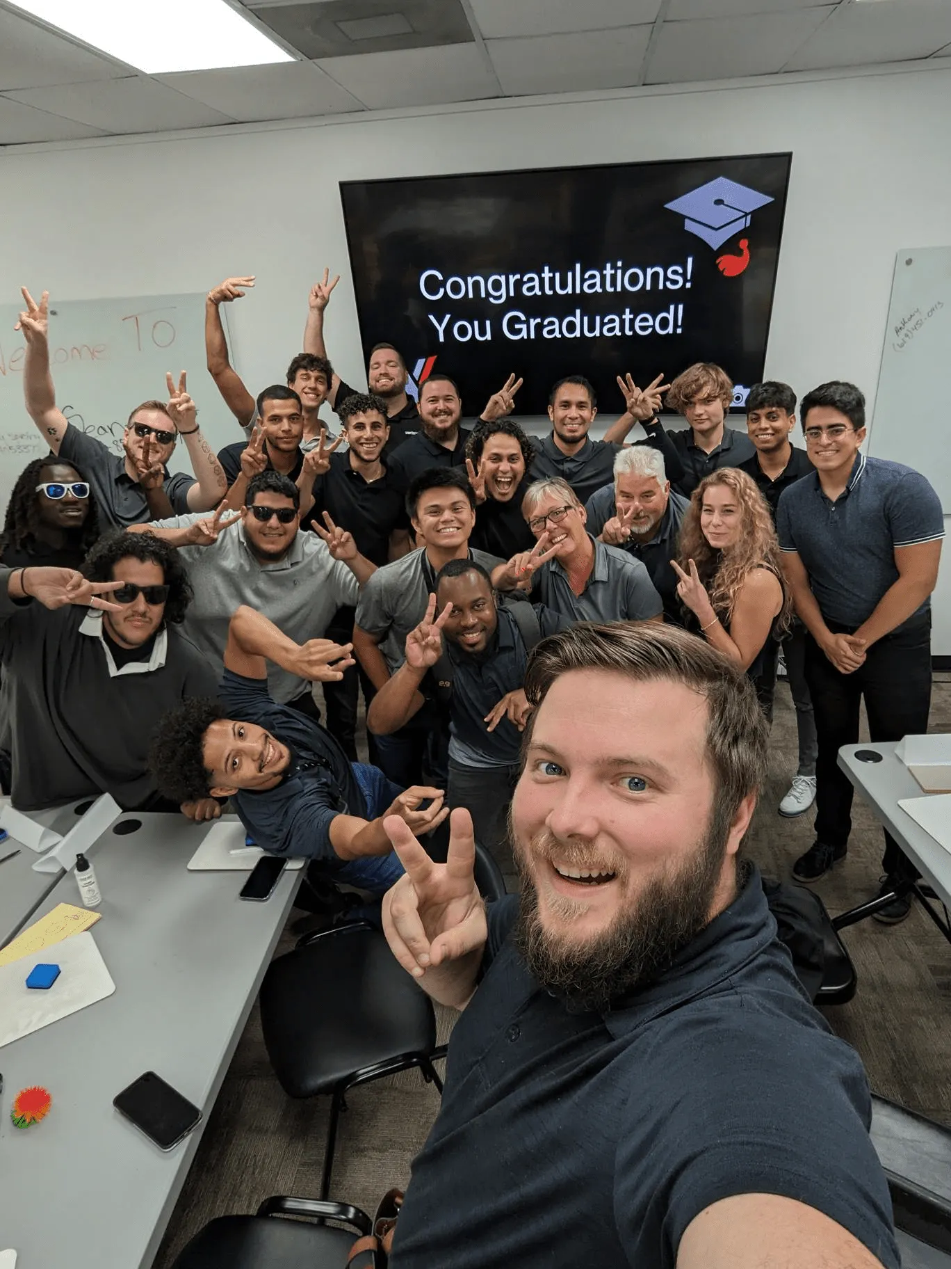 Victra team celebrating a graduation milestone together