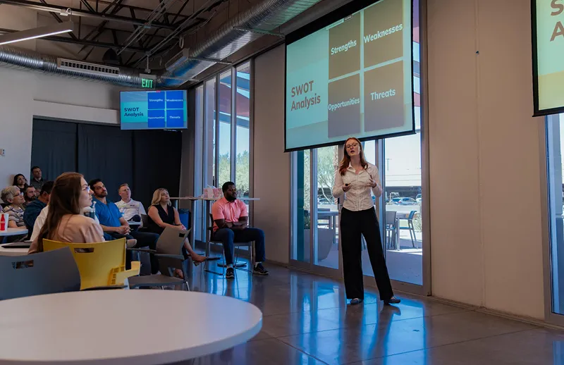 A group of men are taking pictures.