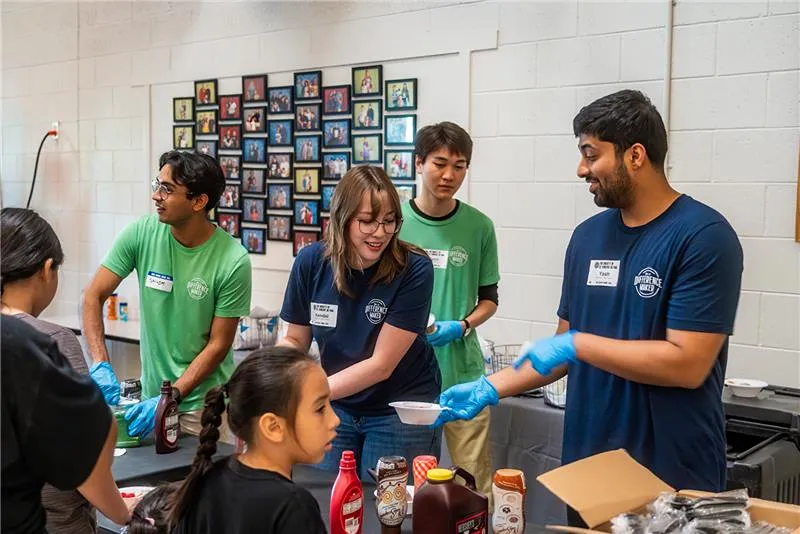 A group of men are taking pictures.