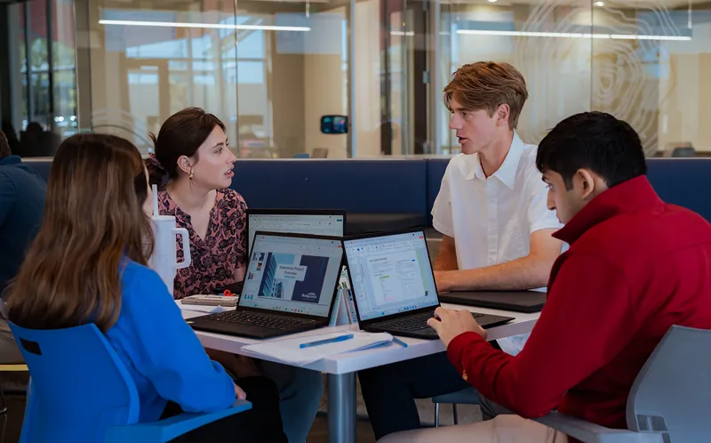 A group of men are taking pictures.