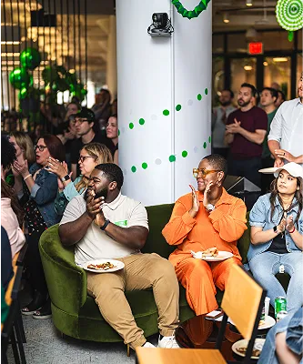 Shake Shack employees clapping and enjoying a gathering