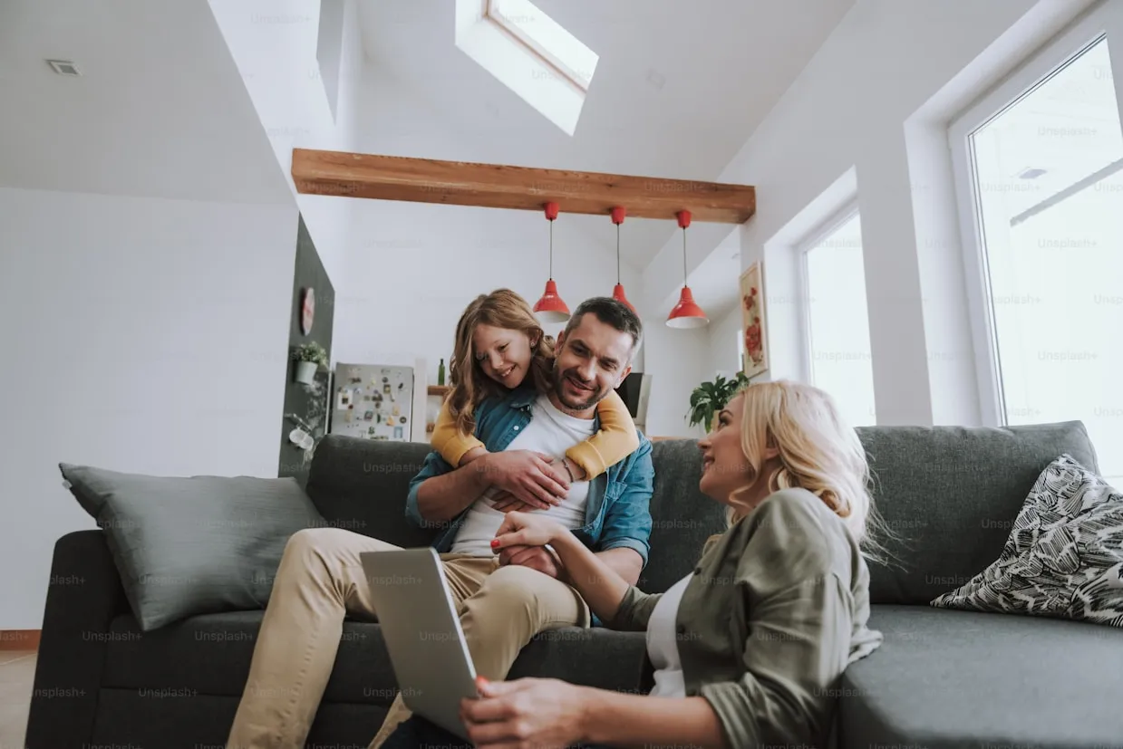 A family relaxing together on a couch