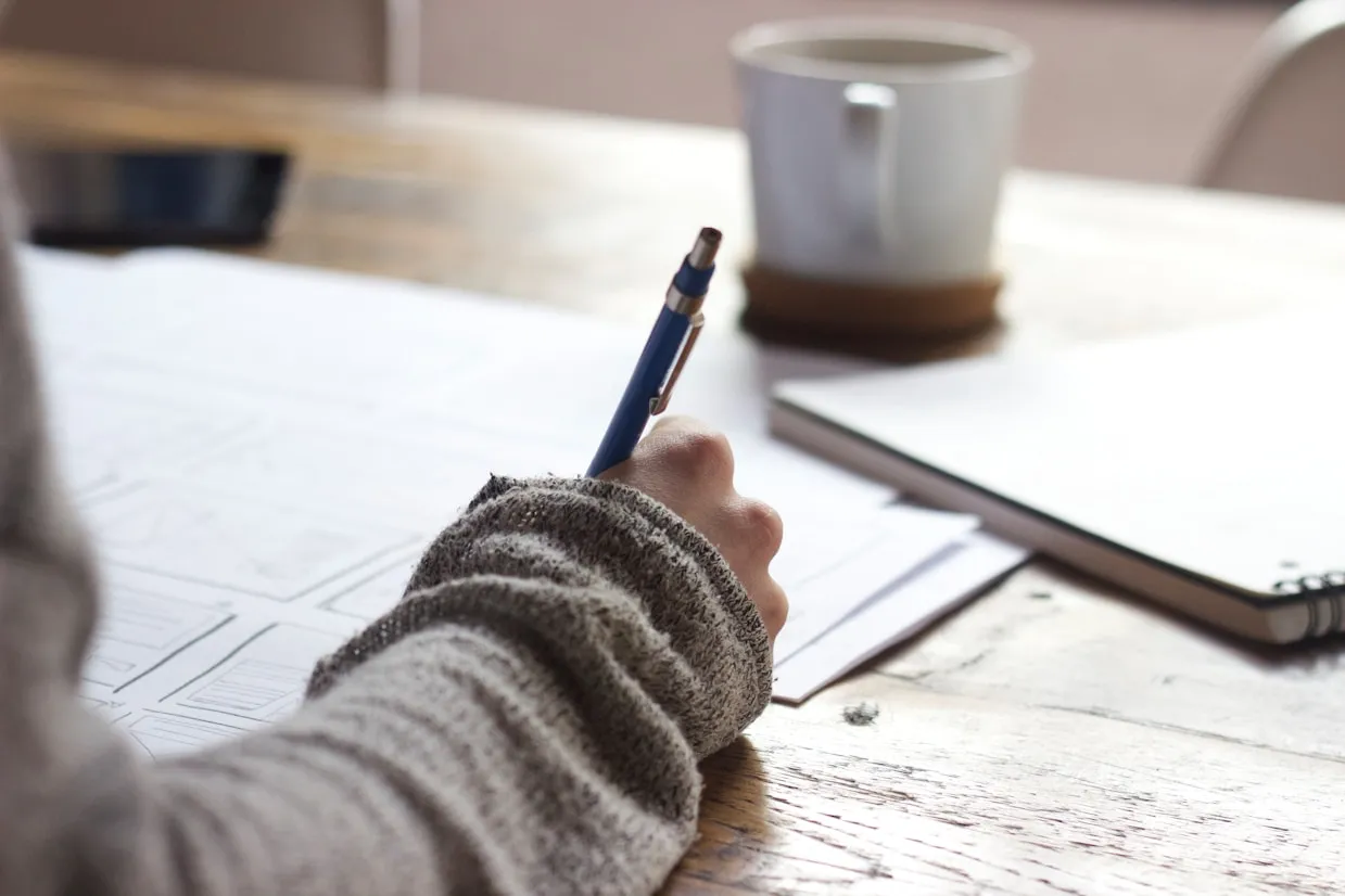A person studying and writing notes