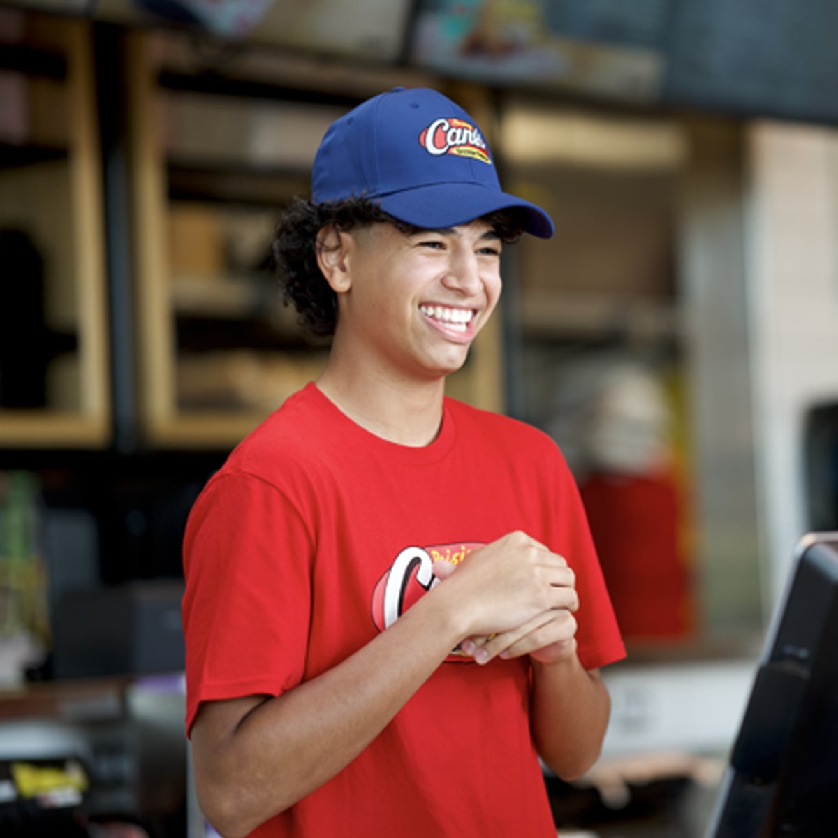 A male employee smiling