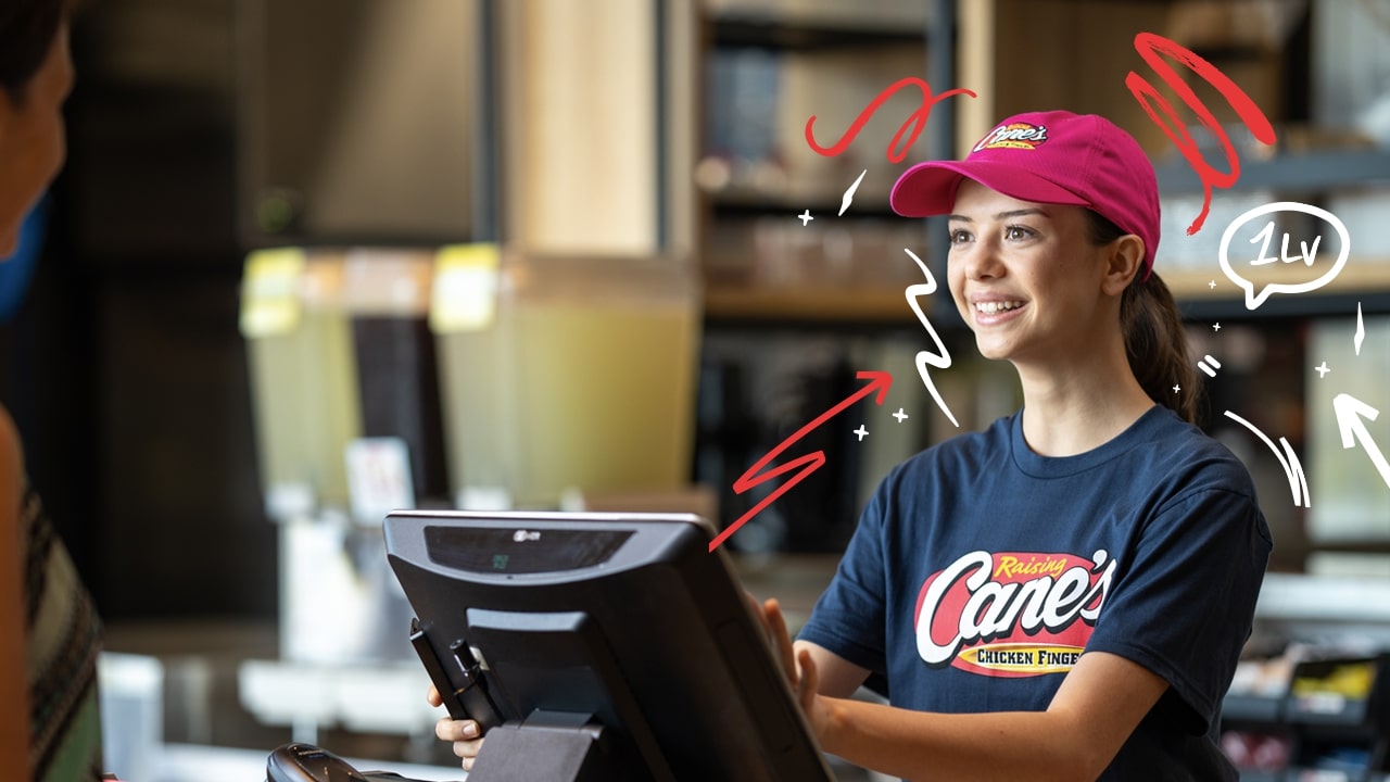 A female cashier smiling