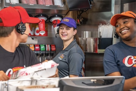 3 employees looking at each other