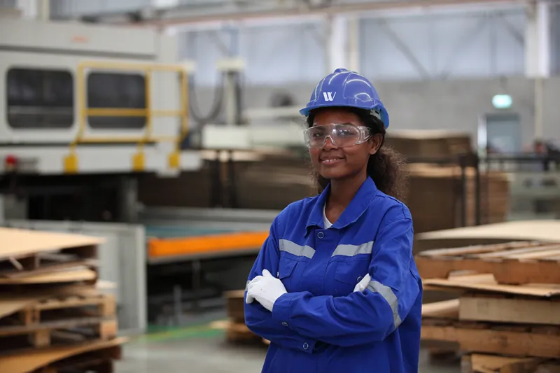 Female employee taking photo at construction site