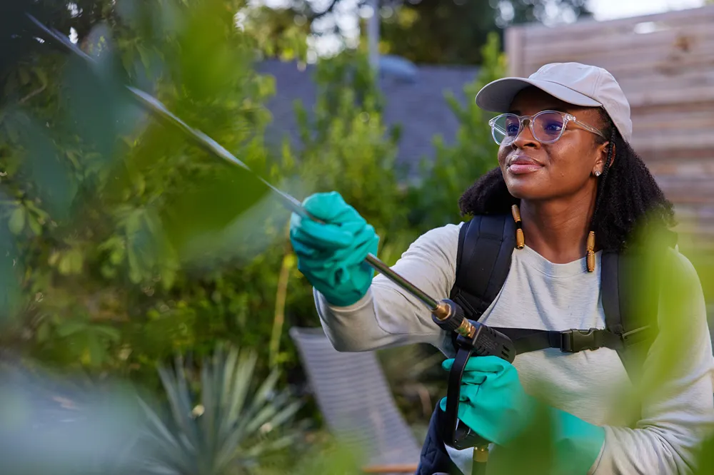 a woman planting trees