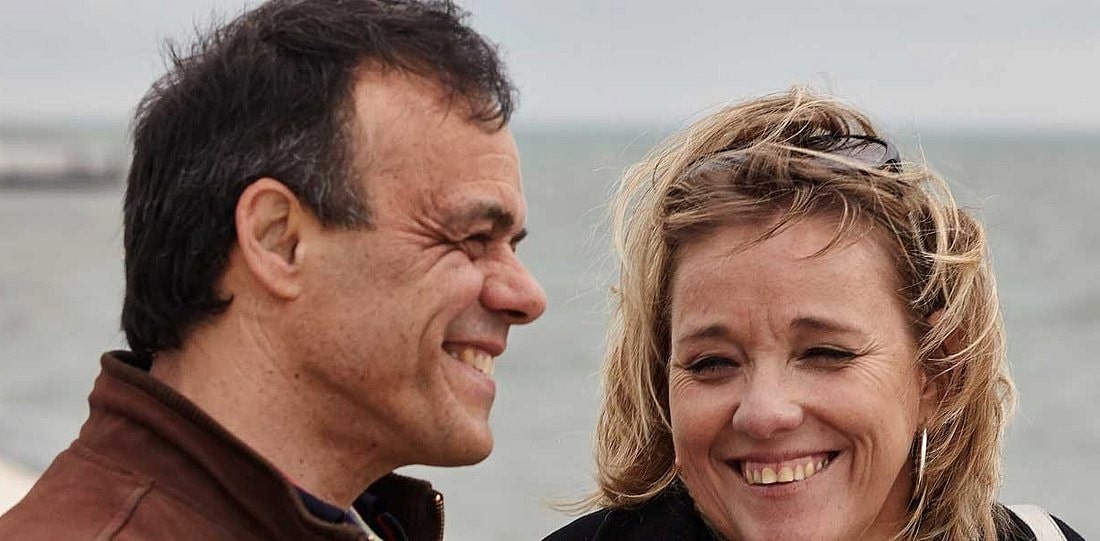 A man and a woman smiling