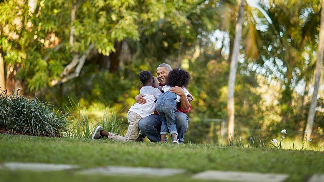 A man playing with his children