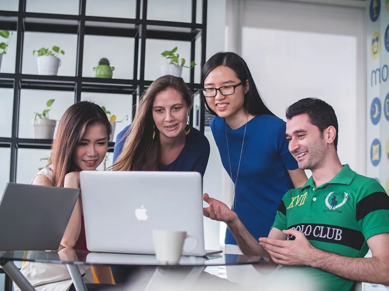 group of students discussing in a room