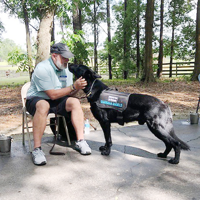 Man playing with a dog in the park