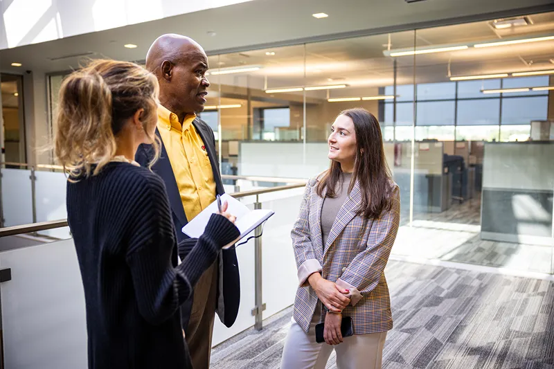 A diverse group of Love's employees in a meeting, representing a variety of corporate career opportunities.