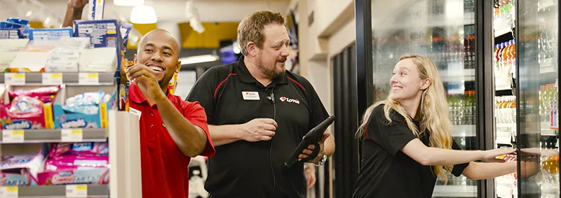 A Love's store leadership member coaching a team member in the store.