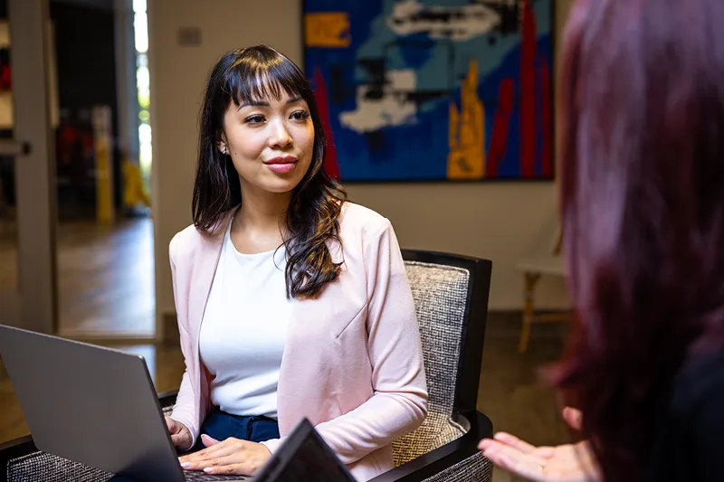 A professional in the Accounting and Finance department at Love's working at their desk.