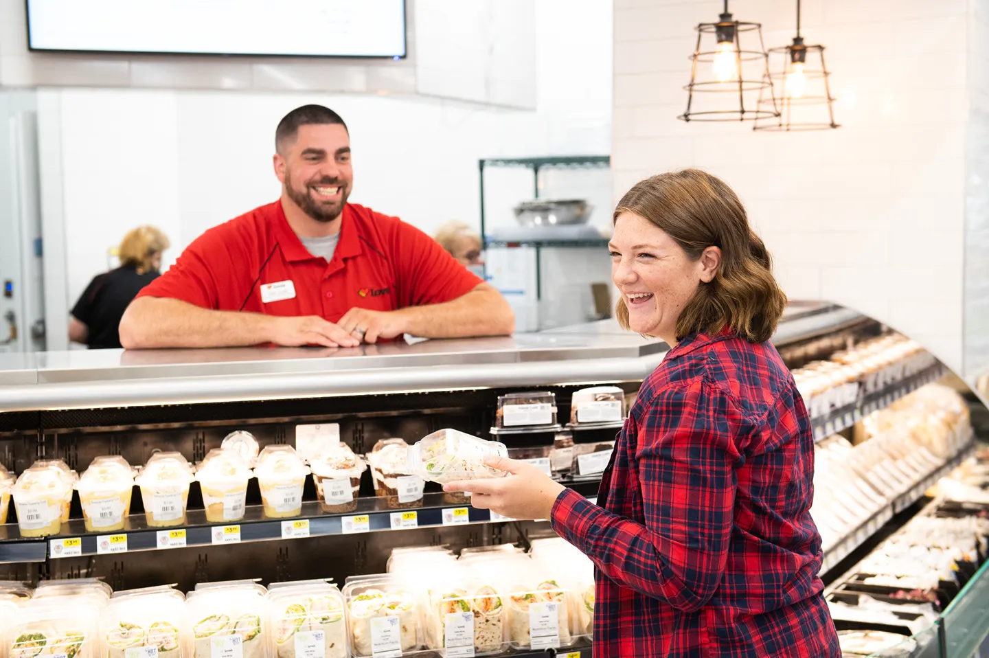 Hero image for Store Leadership careers, showing a manager mentoring an employee within a Love's store.