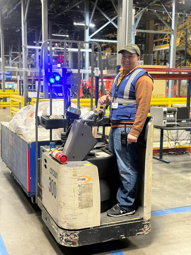 Man next to vacuum cleaner