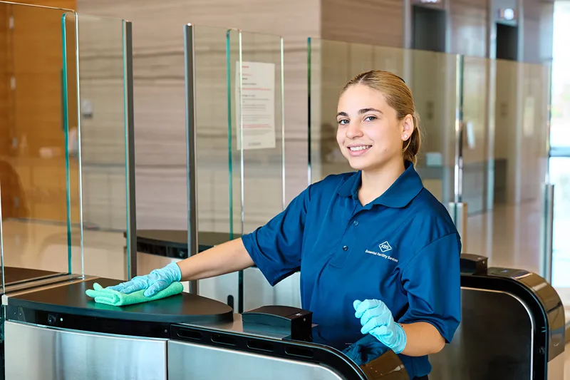 Female worker is cleaning the table
