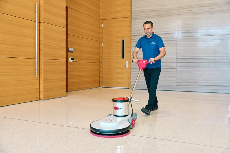 Man using floor cleaning machine