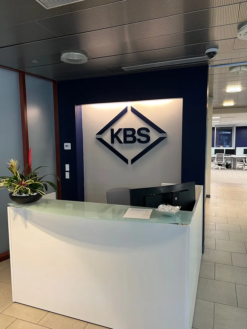 A clean and modern desk setup at a KBS office, ready for a new team member.