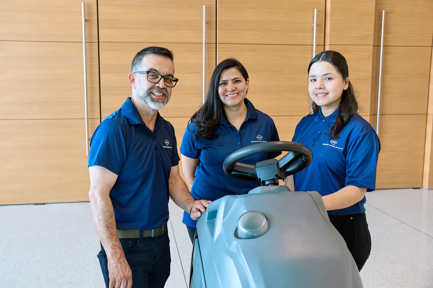 A confident KBS field manager standing with their team, ready to deliver results.
