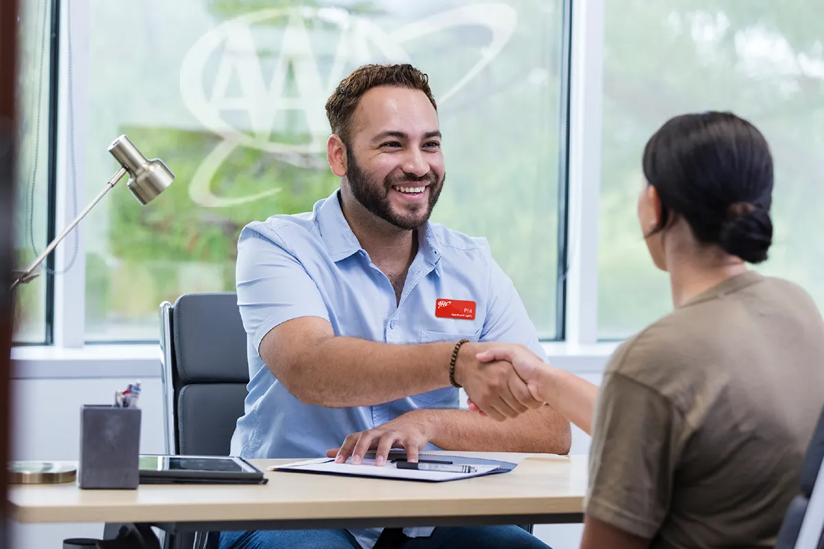 Man shaking hands with customer in office setting
