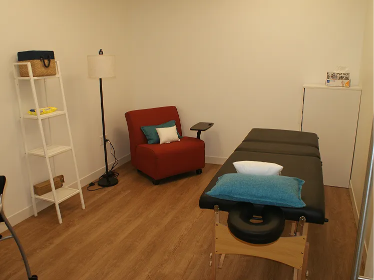 Campbell's quiet retreat room with a bed, a sofa and a bookshelf