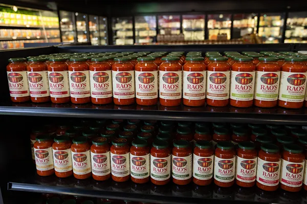 Rows of Rao's Homemade sauce jars at the company headquarters