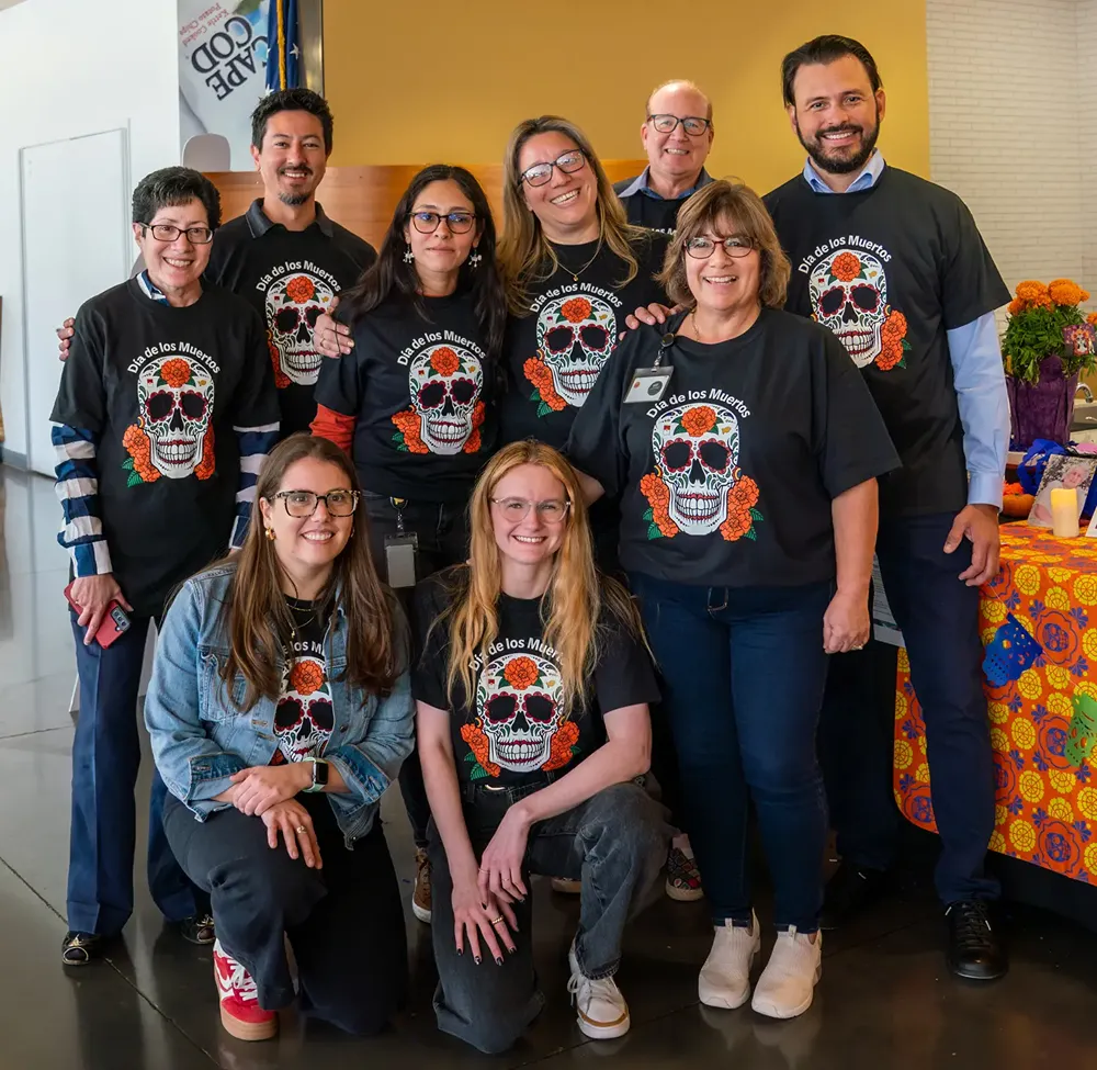 Group of people wearing Dia de los Muertos t-shirts