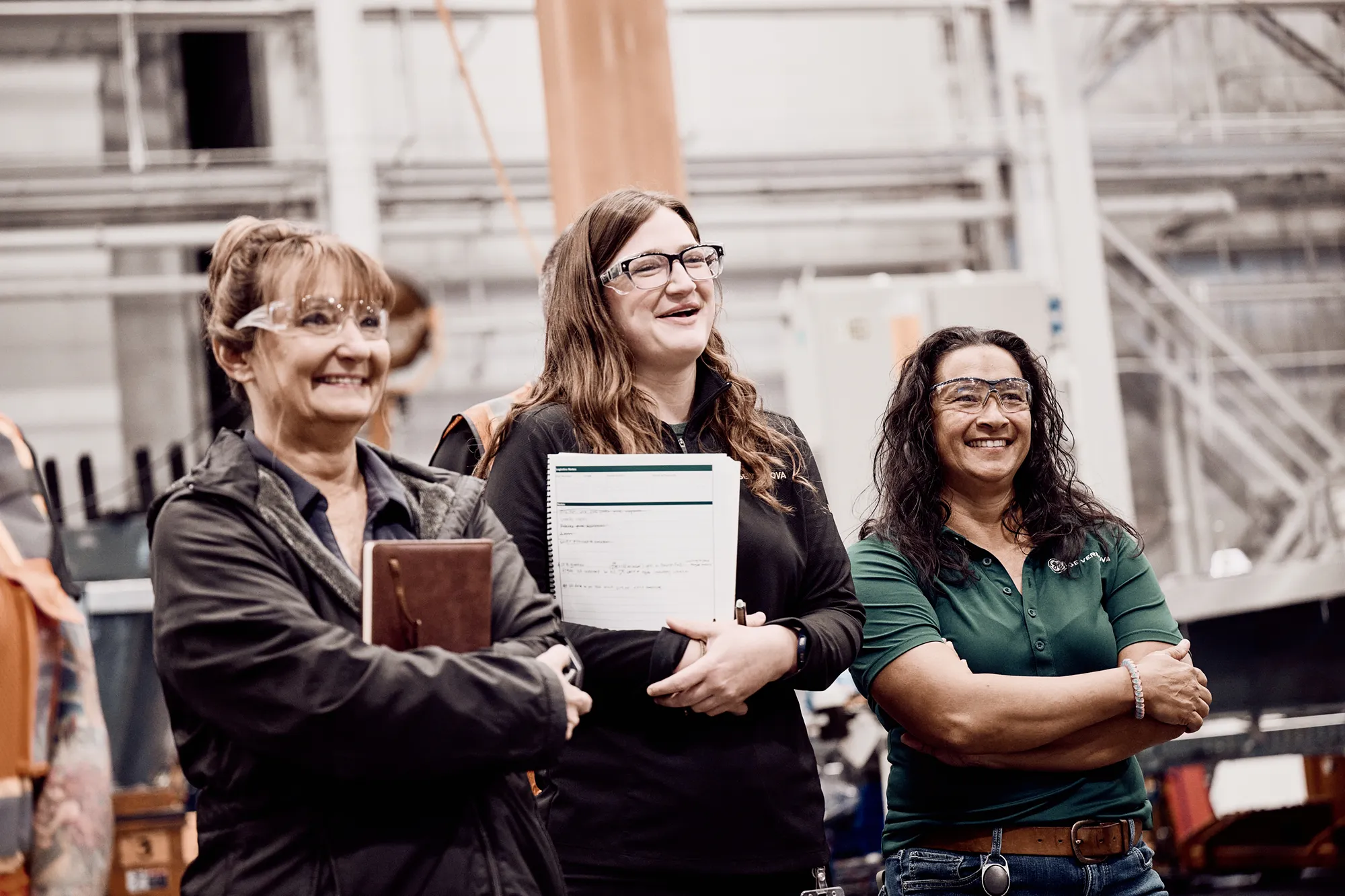 Man wearing safety goggles working in a factory