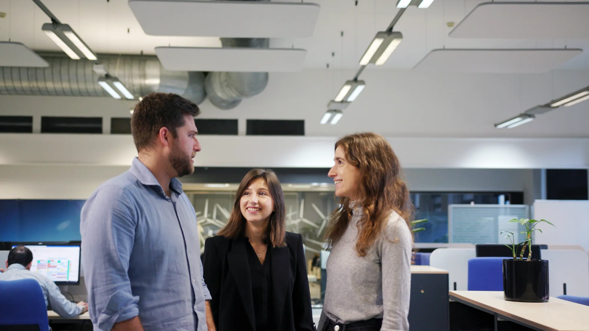 A group of people working inside an office