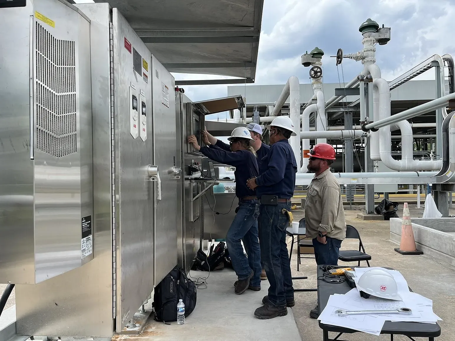 A group of people working on a large piece of machinery