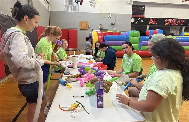A group of people working on crafts at a table