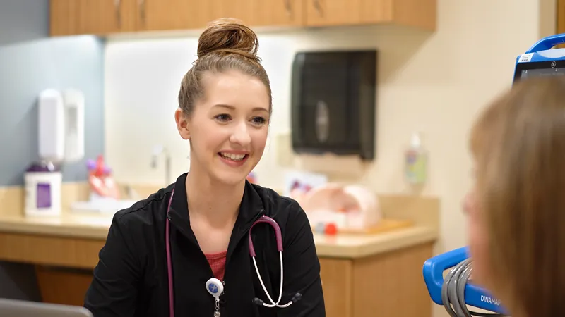 A photo of a female medical professional in a medical office