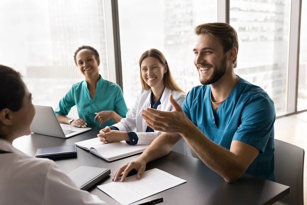 A group of medical professionals sitting together having a conversation