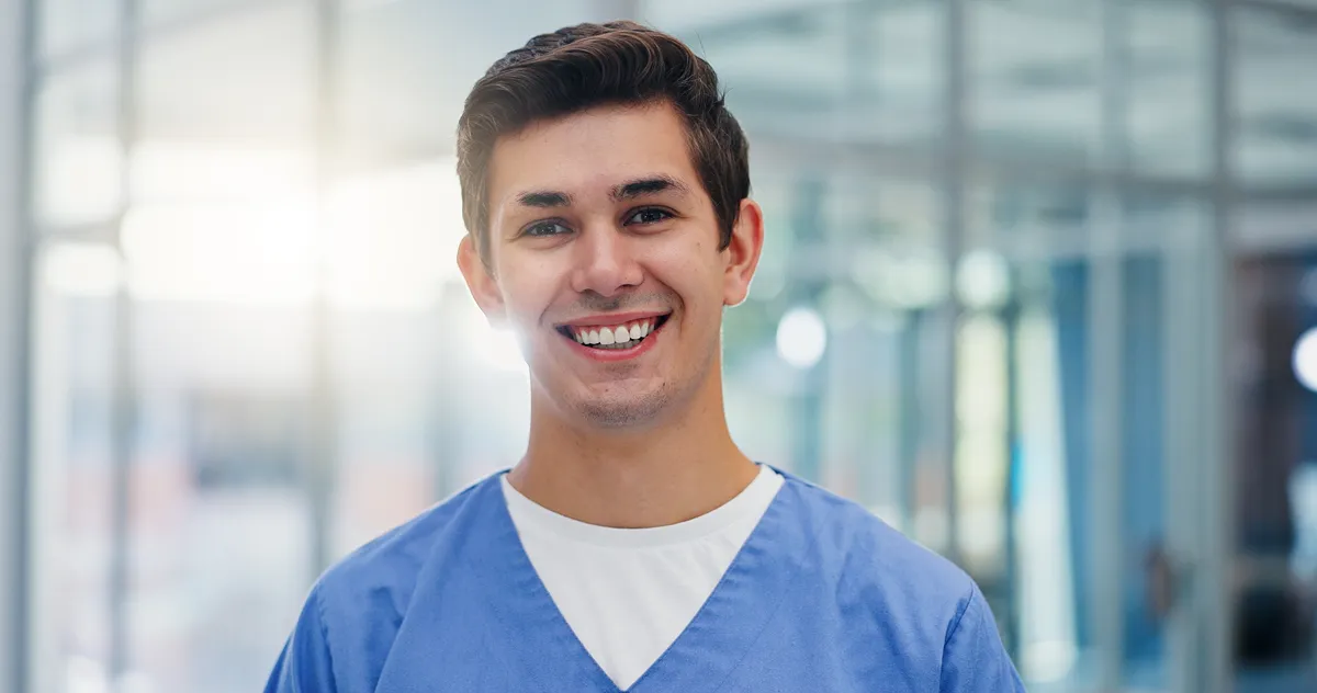 A closeup photo of a medical professional looking towards the camera