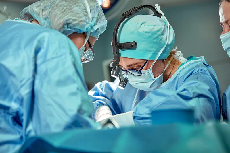 A group of doctors performing surgery