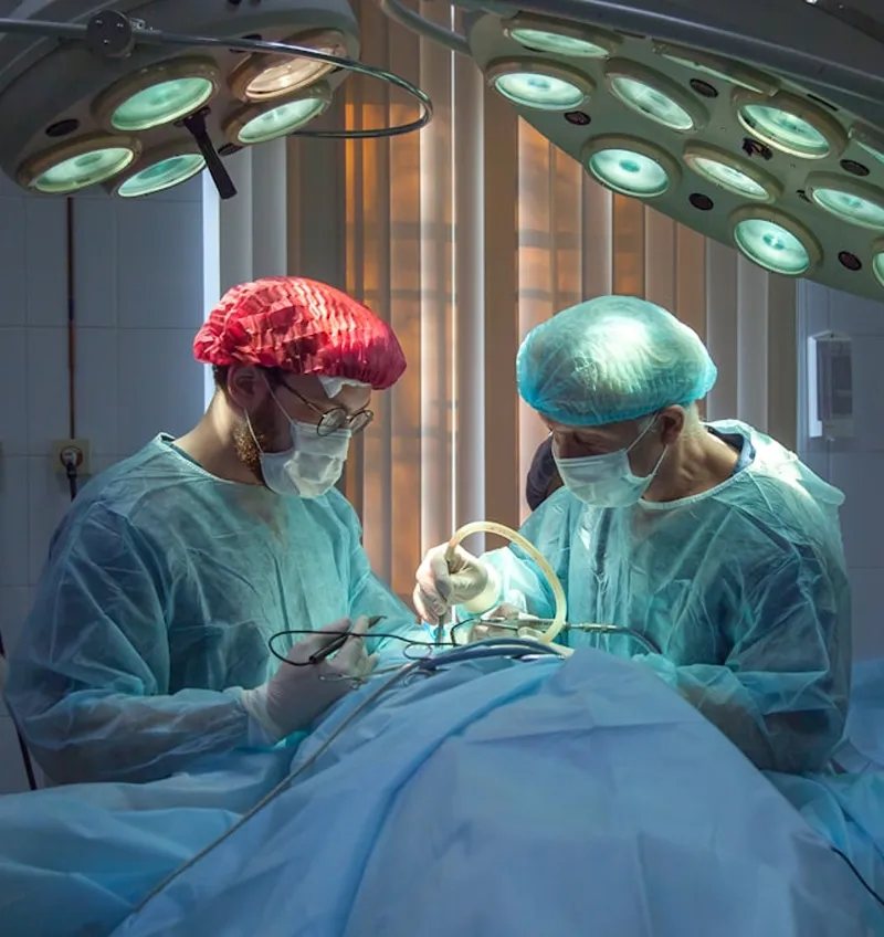 A pair of medical professional performing surgery