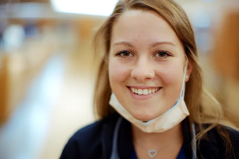 A closeup photo of a female medical professional looking towards the camera