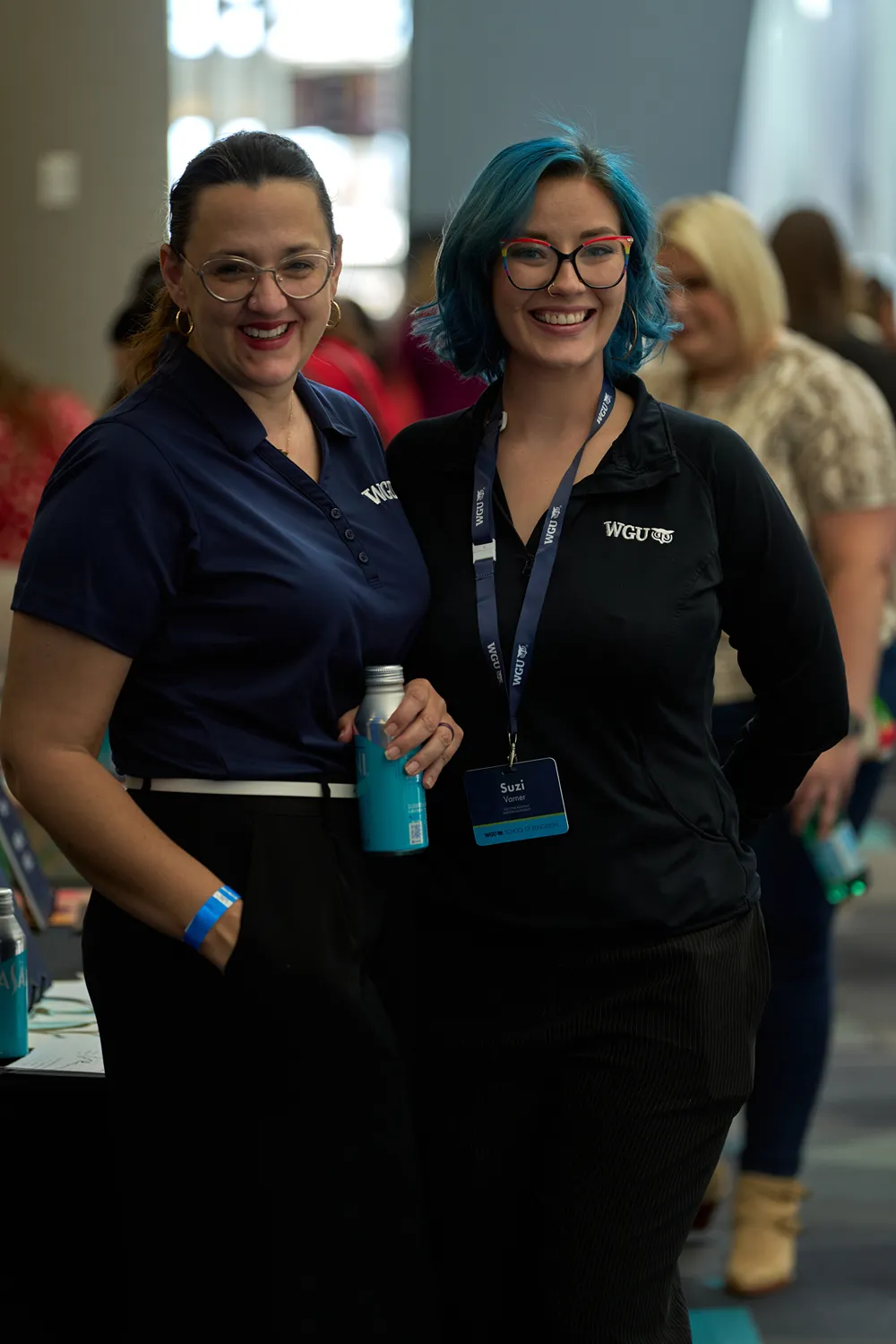 WGU employees smiling and connecting at a company gathering
