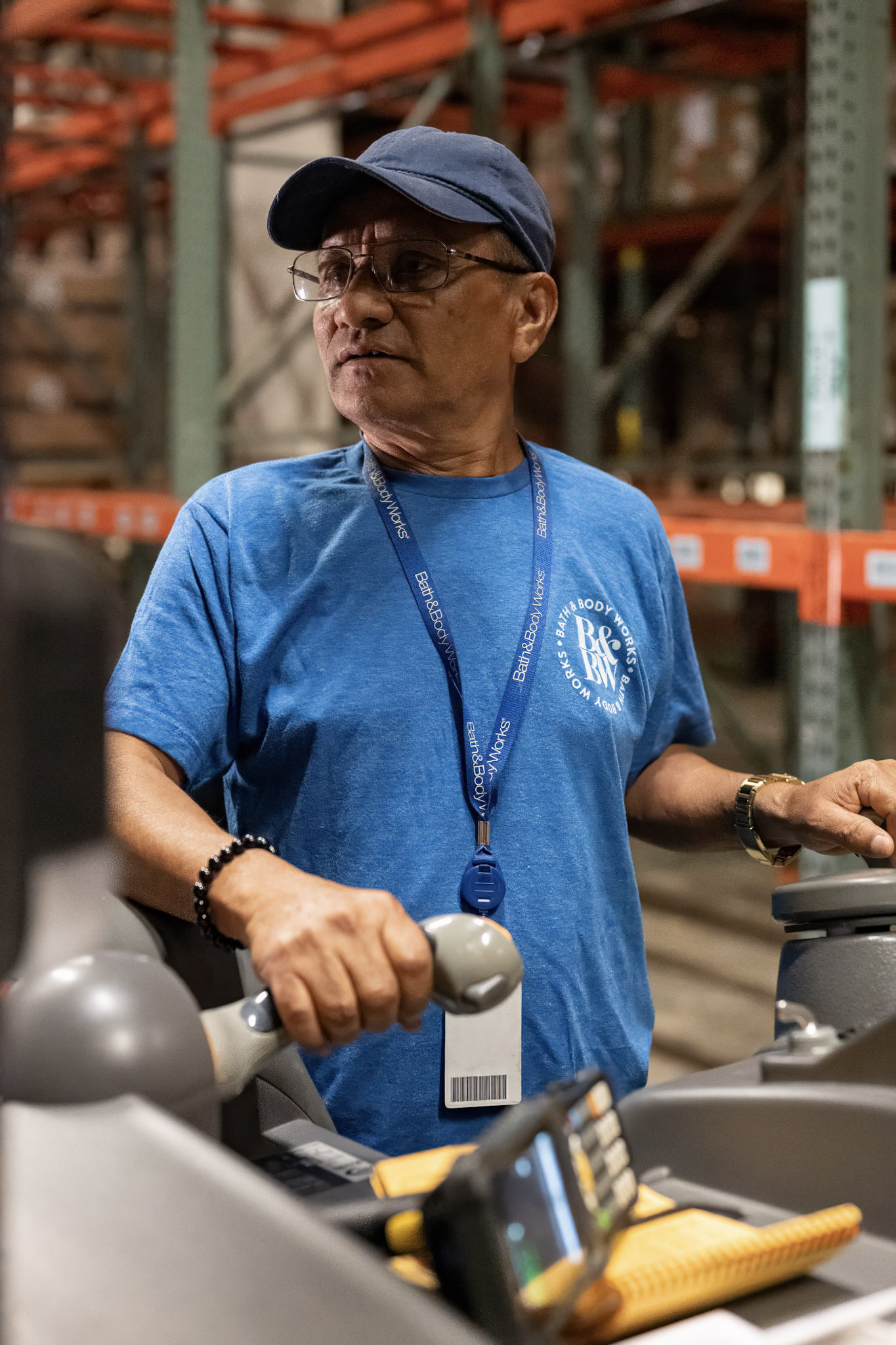 A photo of a man opperating a fork lift