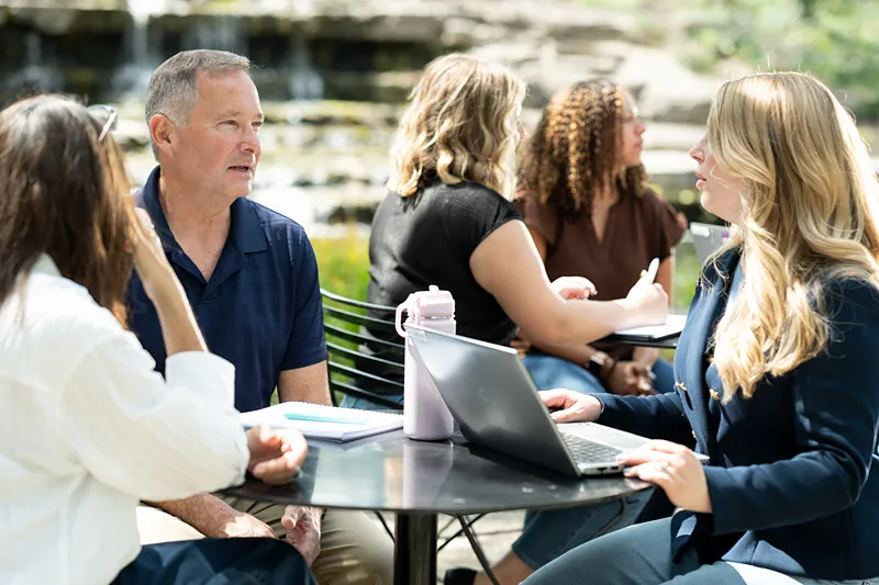 Associates collaborating and connecting at work