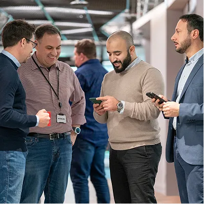 Hitachi employees networking at a corporate event