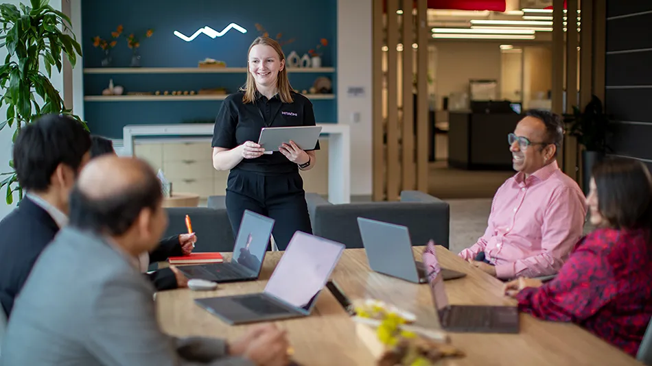 Team collaborating in a modern office meeting room