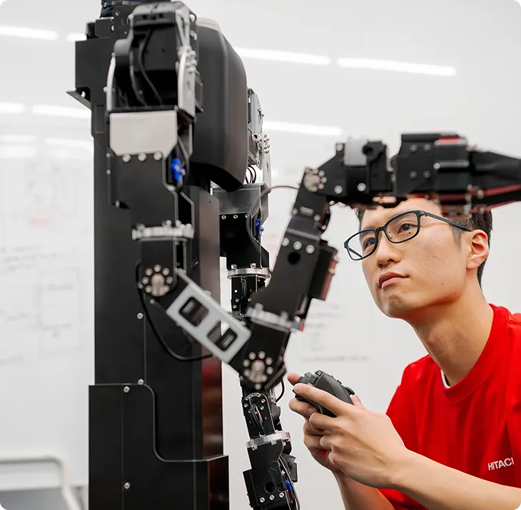 Engineer working with industrial robotics and automation equipment